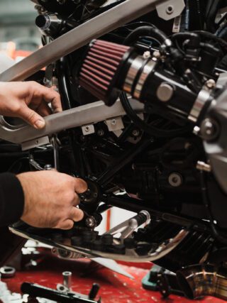 Man fixing a motorcycle